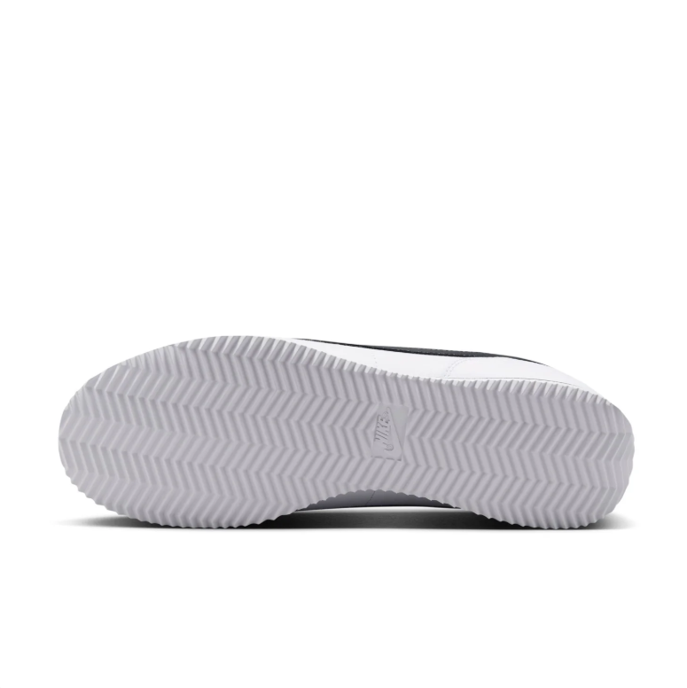 Nike White Low-Top Sneakers with Black Swoosh Details