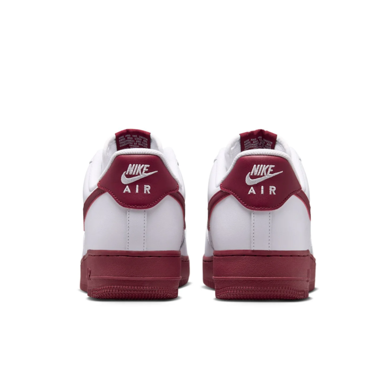Nike White Low-Top Sneakers with Burgundy Swoosh and Soles