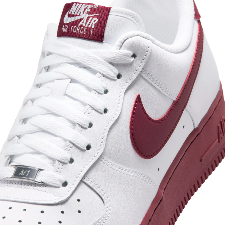 Nike White Low-Top Sneakers with Burgundy Swoosh and Soles