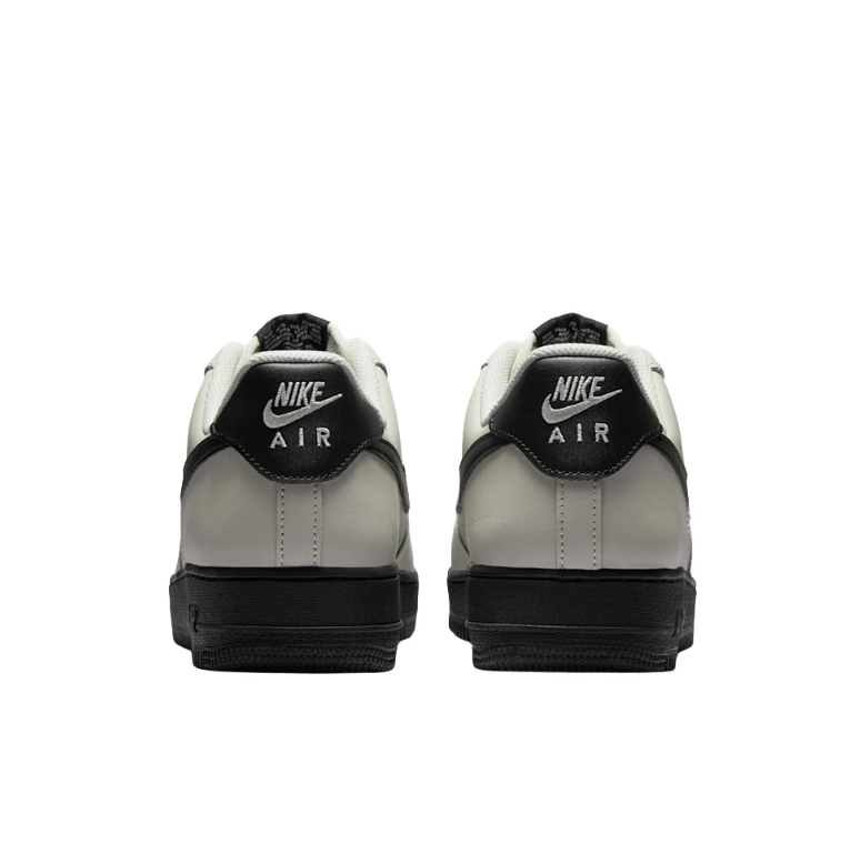 Nike Light Gray Low-Top Sneakers with Black Swoosh and Soles