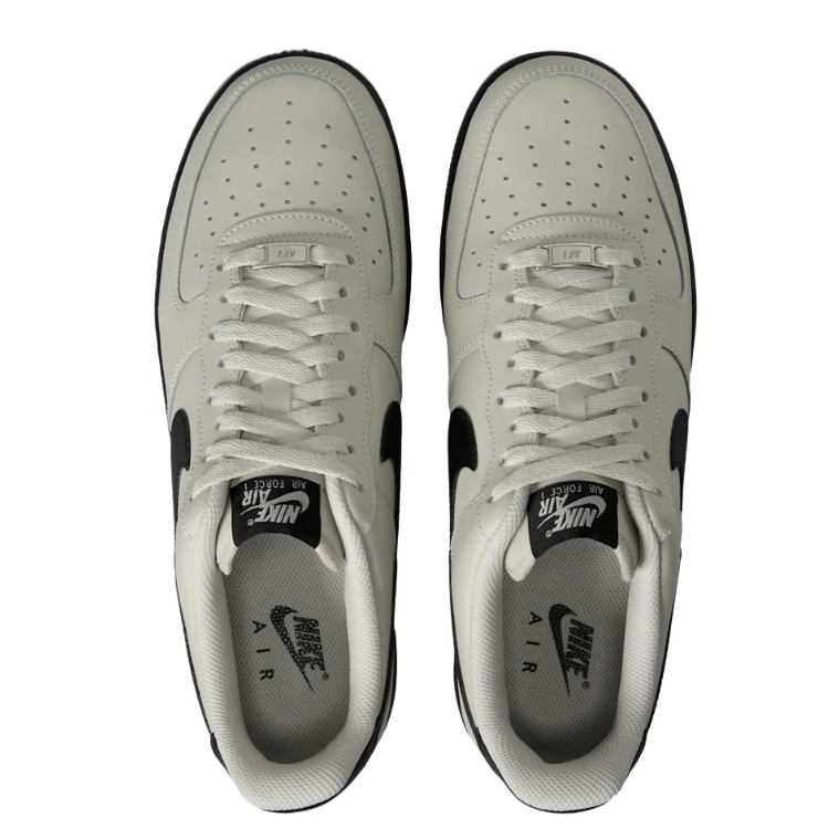 Nike Light Gray Low-Top Sneakers with Black Swoosh and Soles